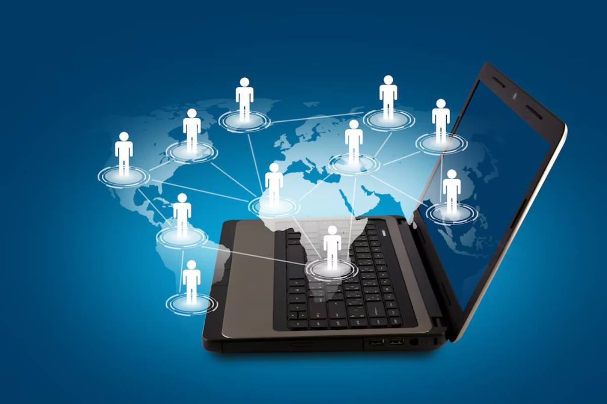 3D illustration of a laptop connected to stylized human figures over a global network map, symbolizing online communication or networking.