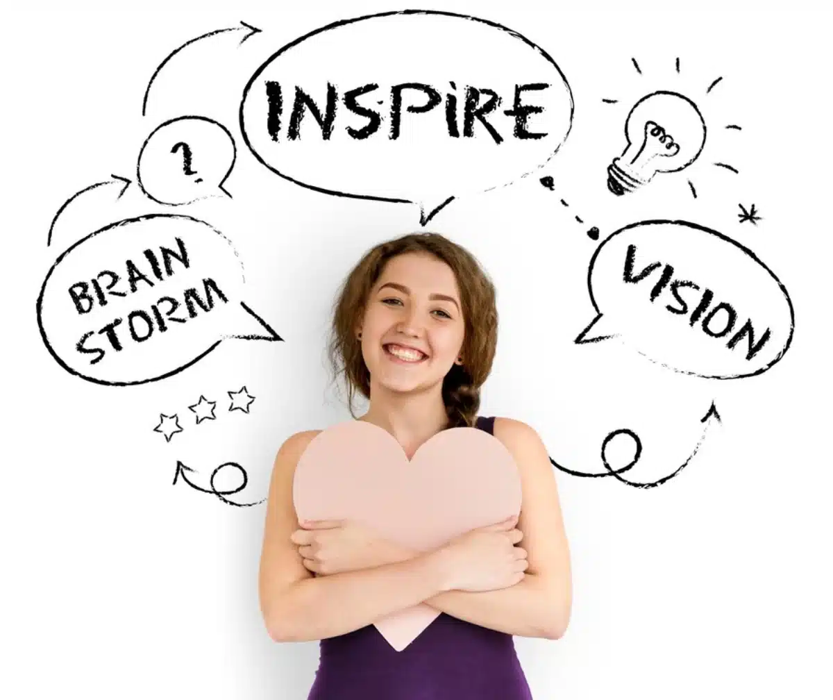 Young woman holding a heart, smiling with creative doodles of inspiration and brainstorming ideas around her.
